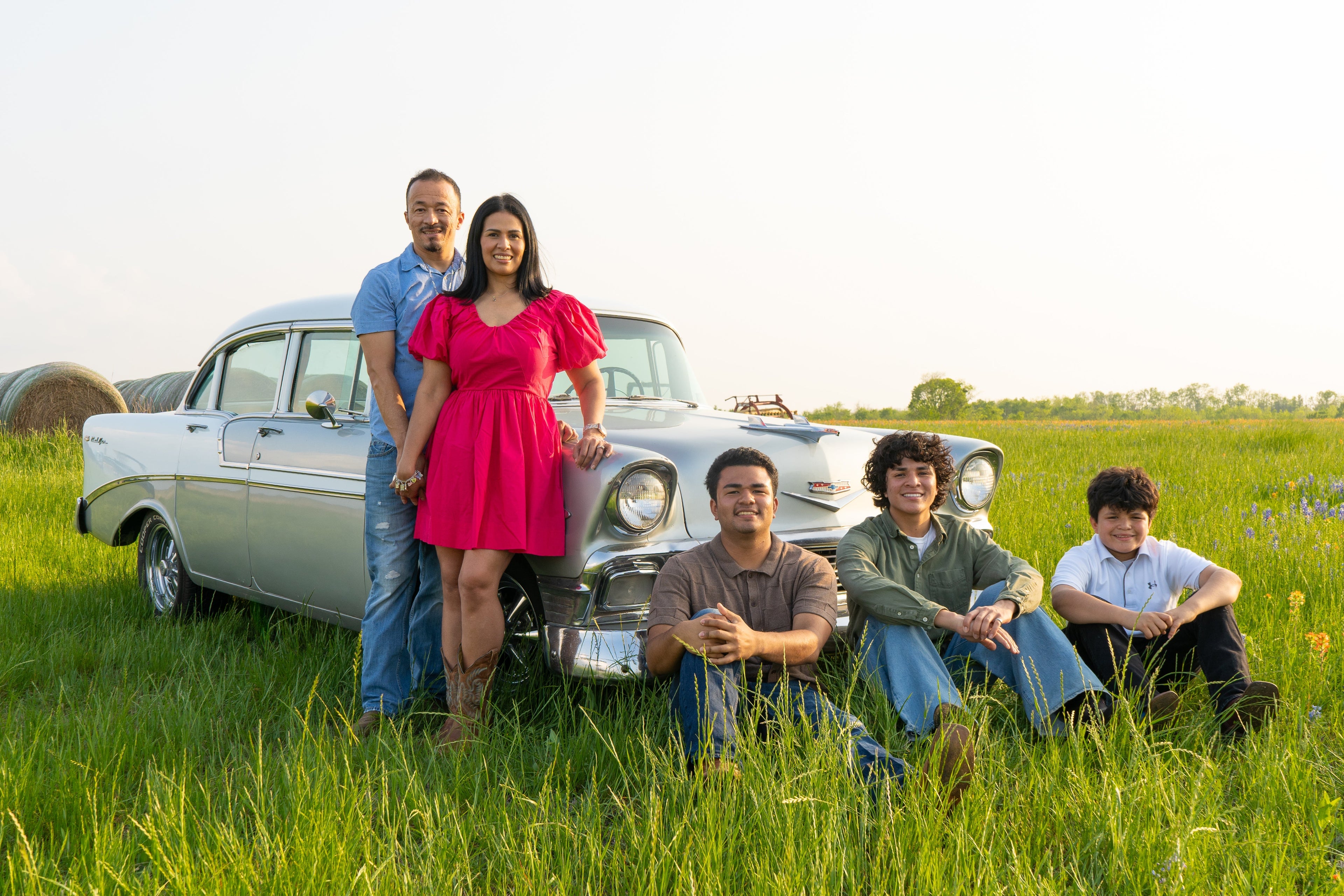 The 3G family posed next to Selah their 1956 chevy Belair