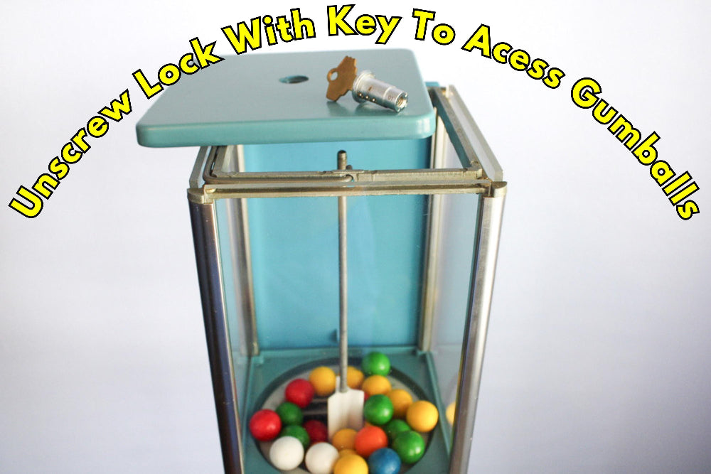 Gumball machine with colorful gumballs and a key on a white background