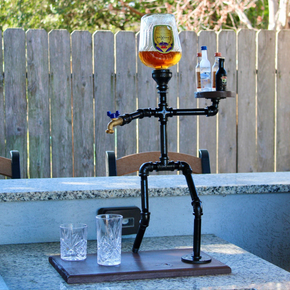 Skeletan-like figure with a glass of beer on a table outdoors