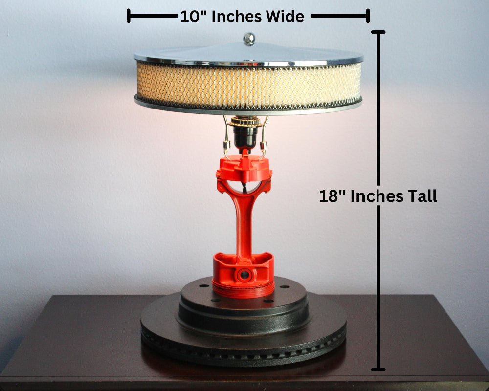 Table lamp with measurements indicated on a plain background