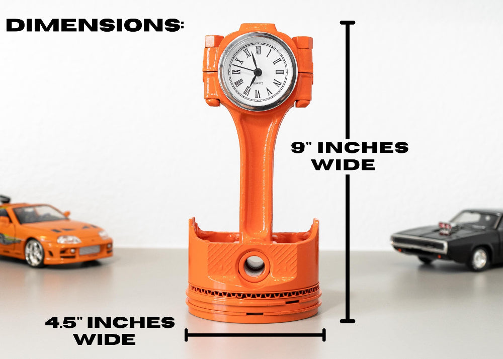 Orange clock shaped like a car engine block with dimensions displayed