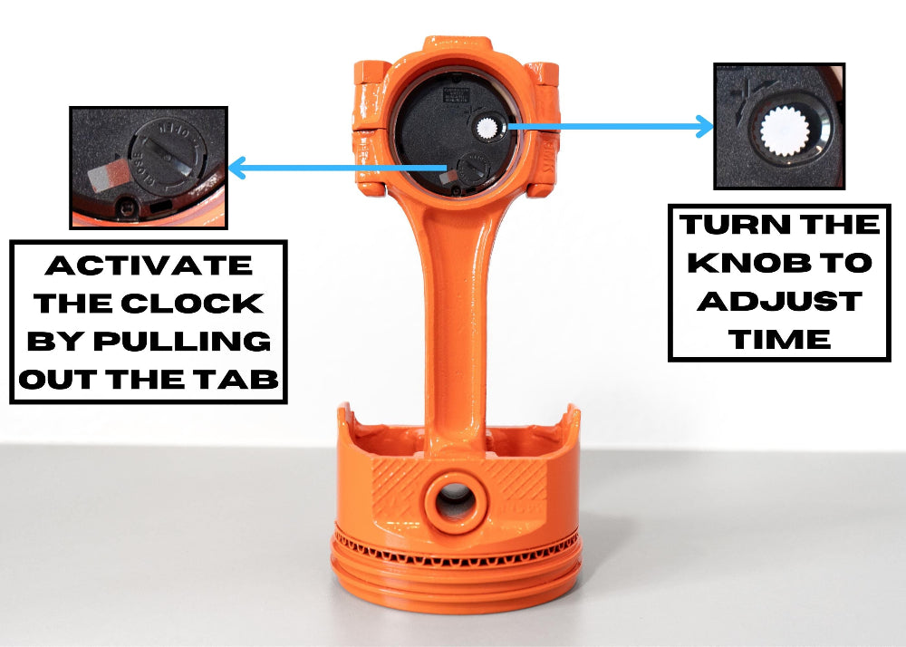 Orange clock mechanism with instructions on how to activate and adjust time.