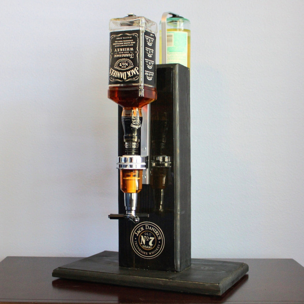 Whiskey decanter with three bottles on a wooden stand against a white background