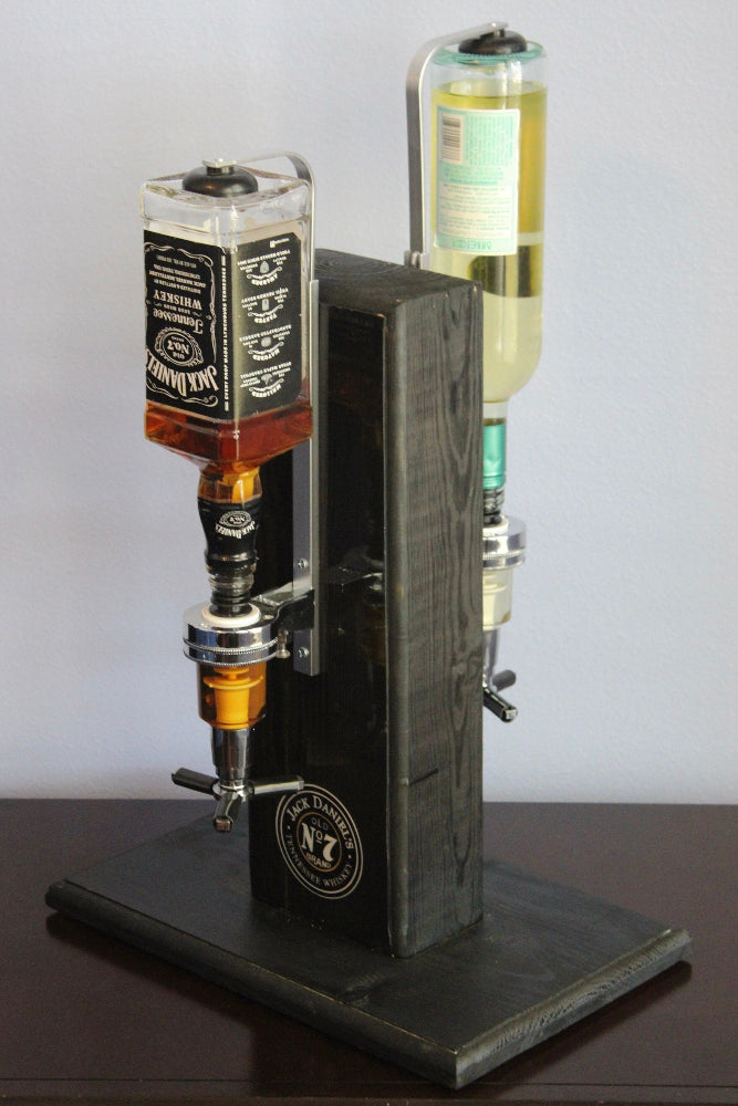 Beverage dispenser with Jack Daniel's branding on a dark surface.