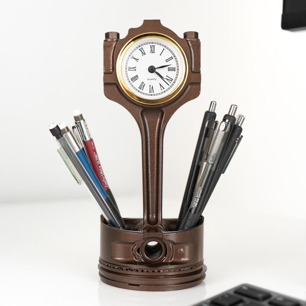 Decorative clock with pen holder on a desk
