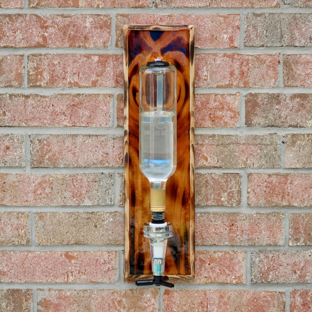 Decorative glass object with tortoiseshell pattern on a brick wall