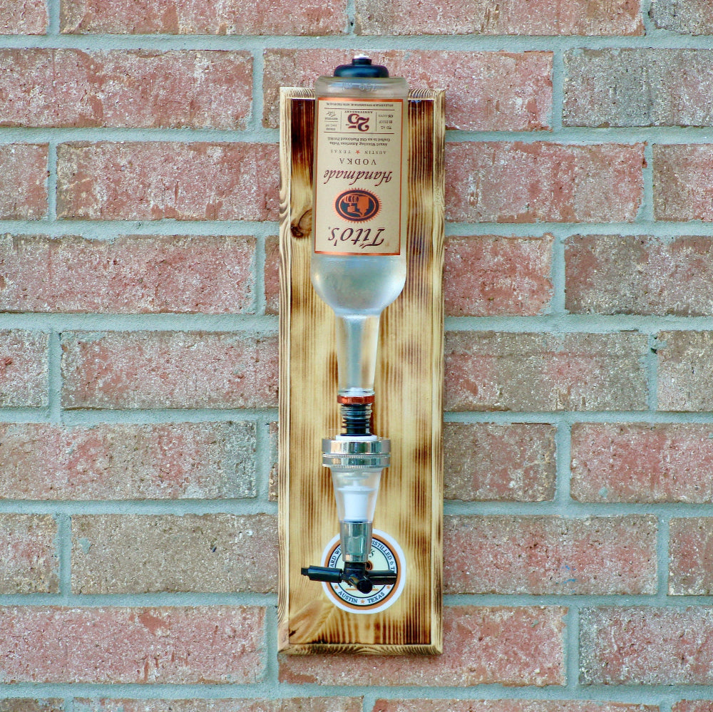Wooden beer tap mounted on a brick wall