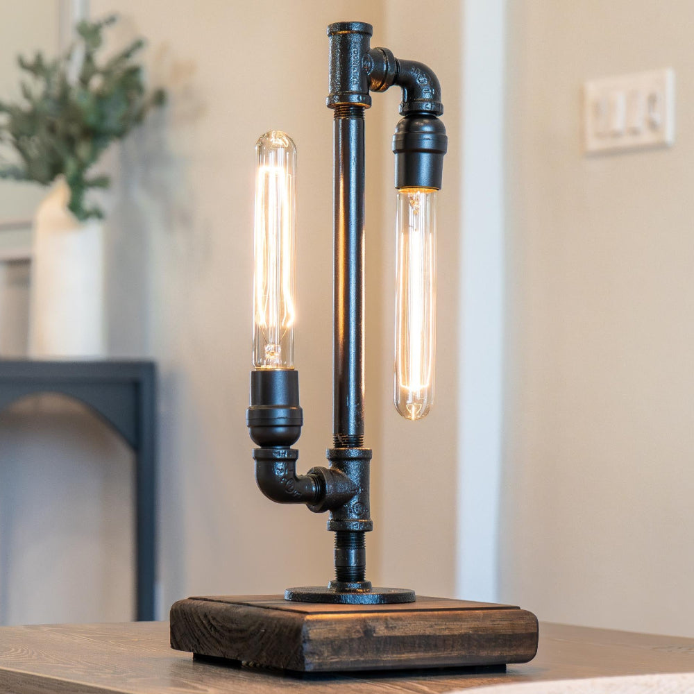 Table lamp with industrial design on a wooden surface, blurred background