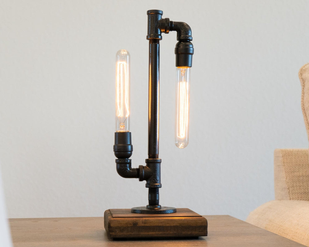 Table lamp with industrial design on a wooden surface, blurred background