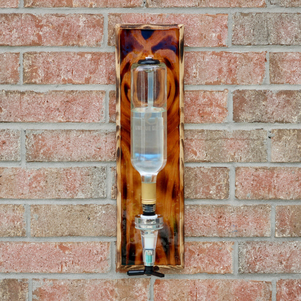 Decorative glass object with tortoiseshell pattern on a brick wall