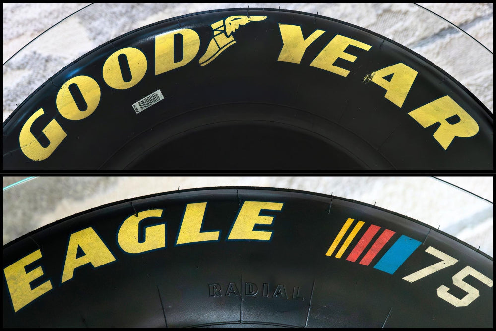Two Goodyear Eagle tires with visible branding on a textured surface.