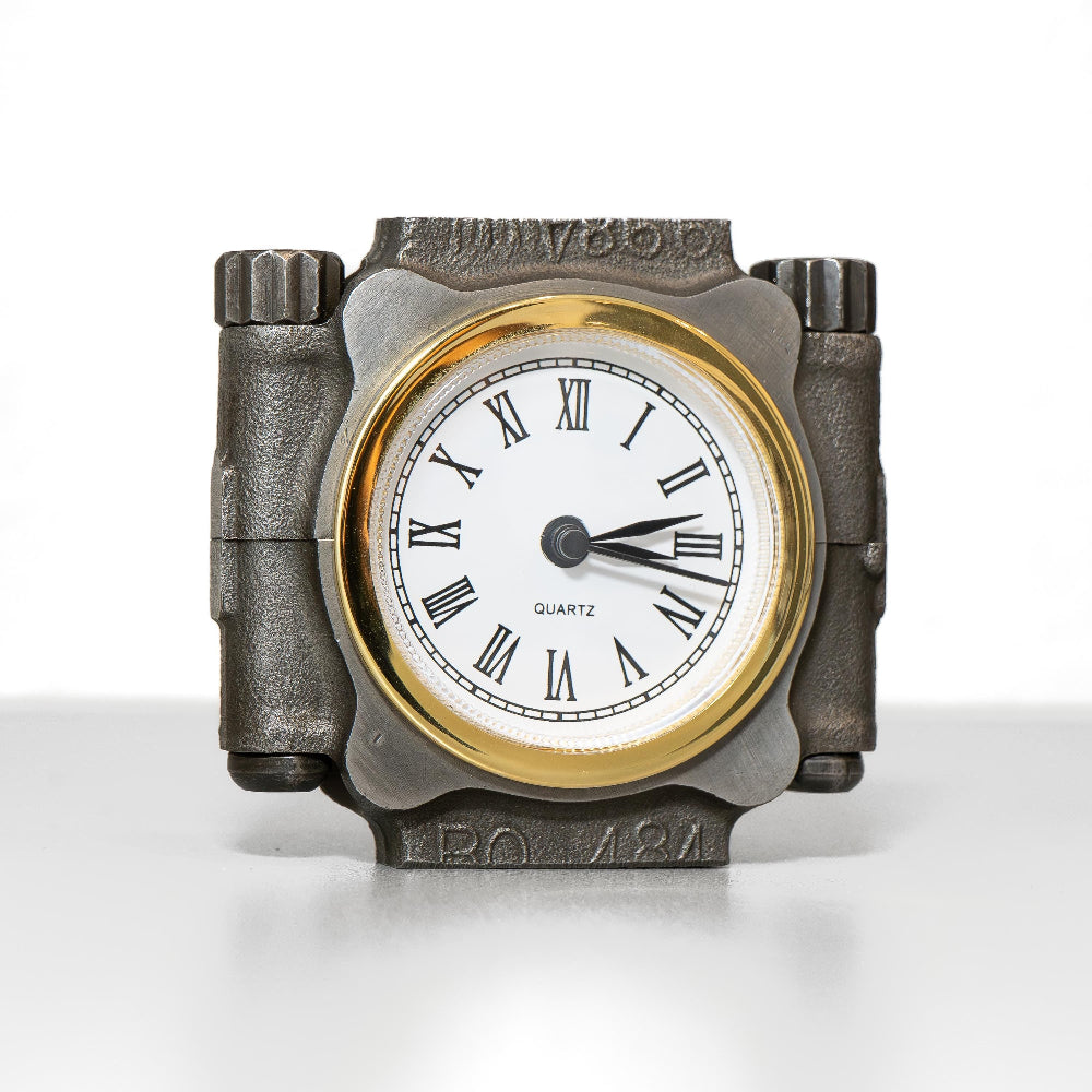 Decorative clock with Roman numeral face on a white background