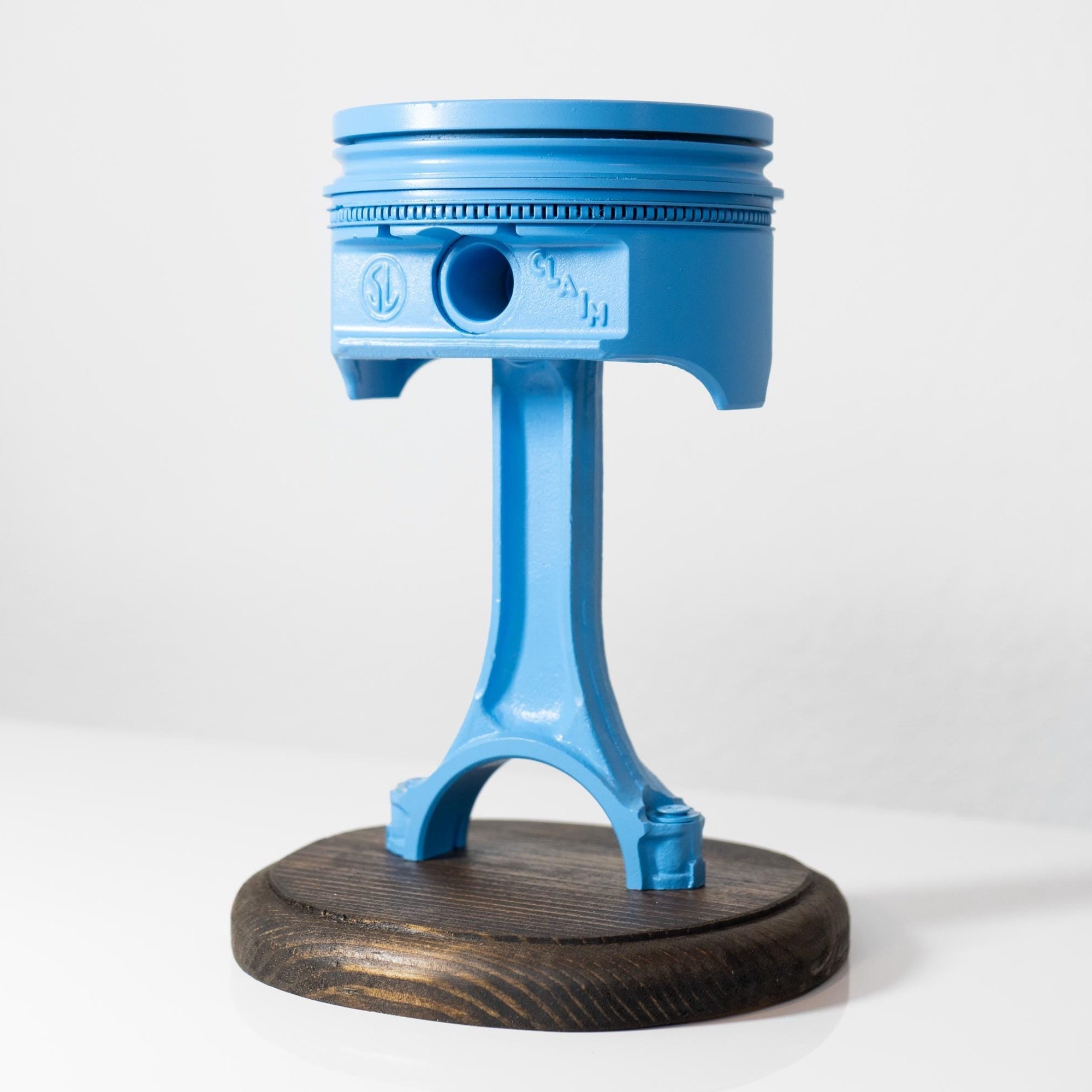 Blue piston-shaped stool on a white background