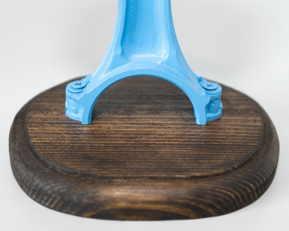 Blue metal stand with a wooden base on a white background