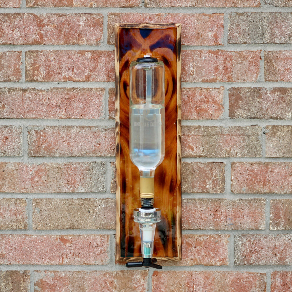 Decorative glass object with tortoiseshell pattern on a brick wall