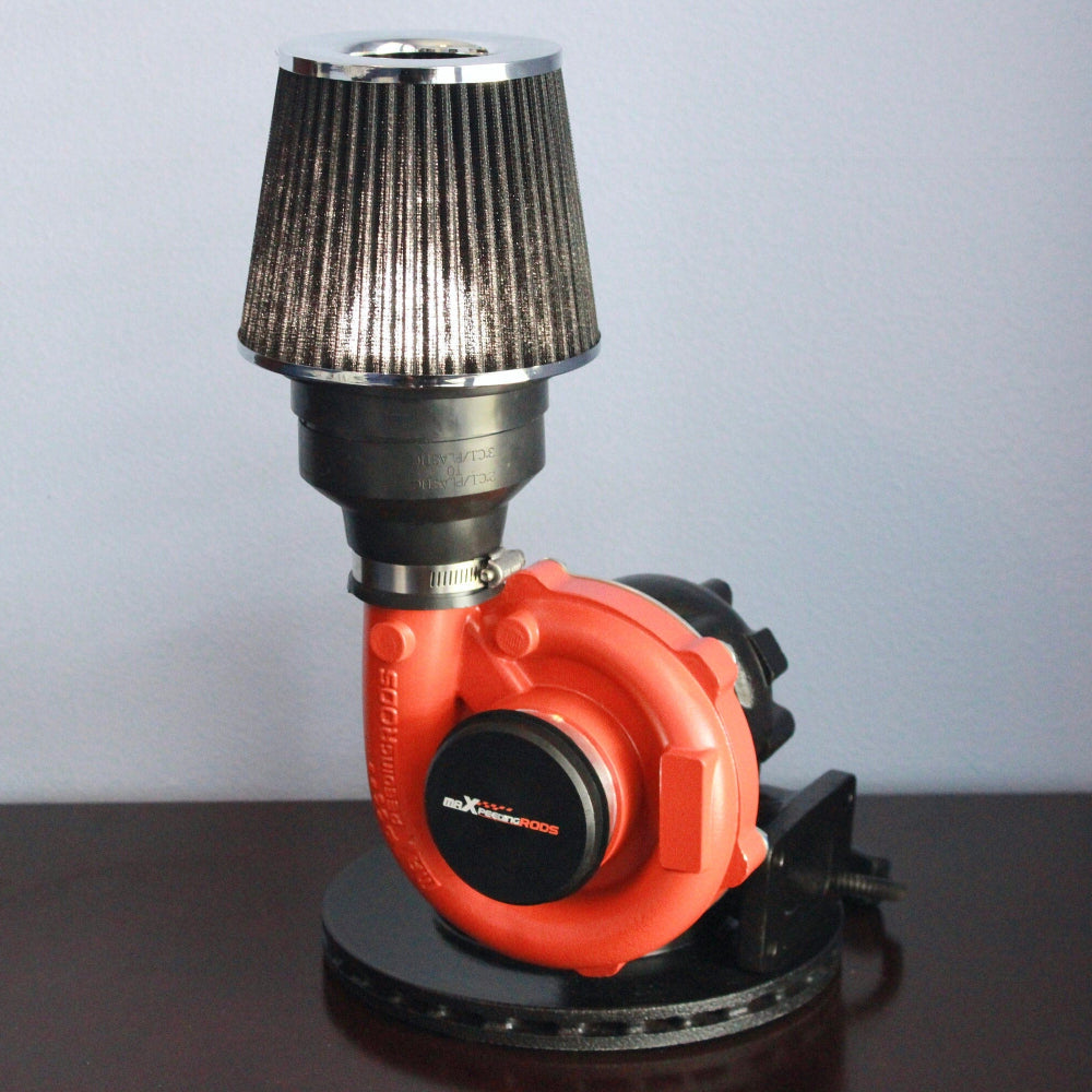 Red turbocharger with a black air filter on a gray background