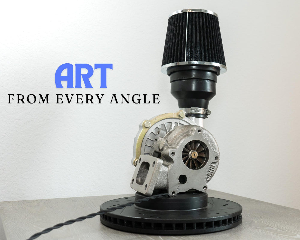 Mechanical object on a stand with 'ART FROM EVERY ANGLE' text on a white background