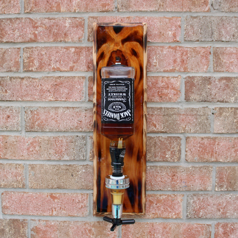 Jack Daniel's bottle opener and cap catcher on a brick wall
