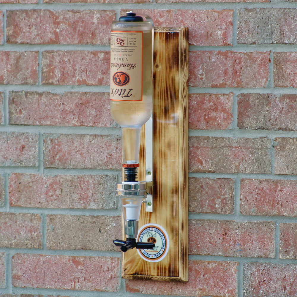 Wooden beer dispenser mounted on a brick wall