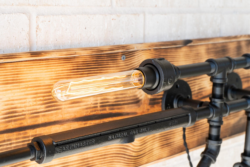 Wooden wall with industrial-style light fixture featuring a visible bulb.
