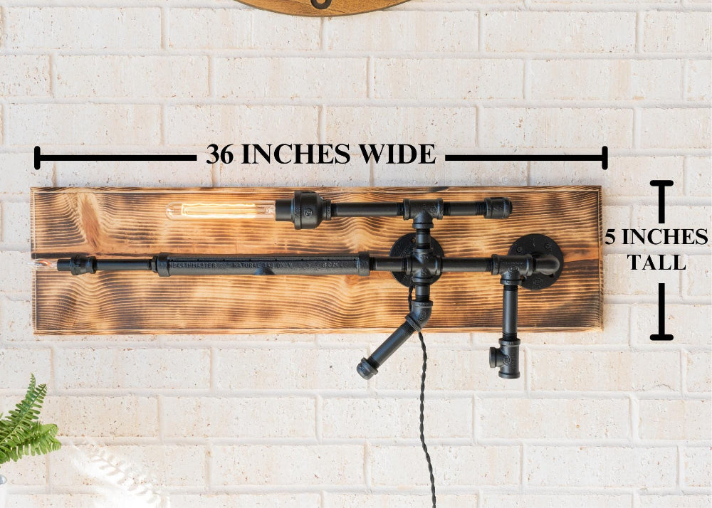 Wooden wall art with metal pipes and measurements on a white brick wall.