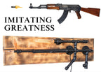 Weapon replica with wooden stock and metal components on a white background, accompanied by text 'IMITATING GREATNESS'.