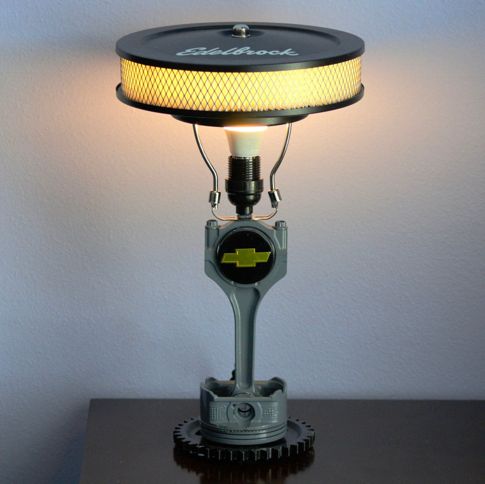 Automotive piston lamp made from real car parts, showcasing clean metal design and authentic mechanical character.