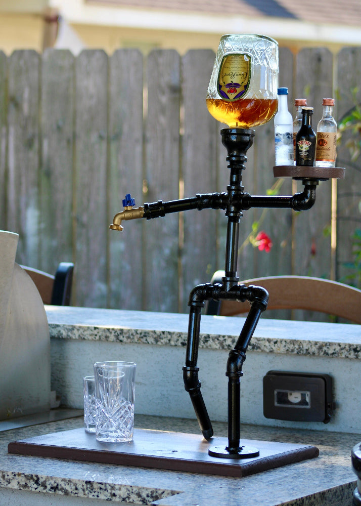Beverage dispenser shaped like a skeleton with drinks on a patio