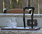 Decorative metal stand with glasses on a countertop