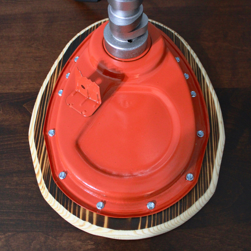 Red sanding disc on a wooden surface