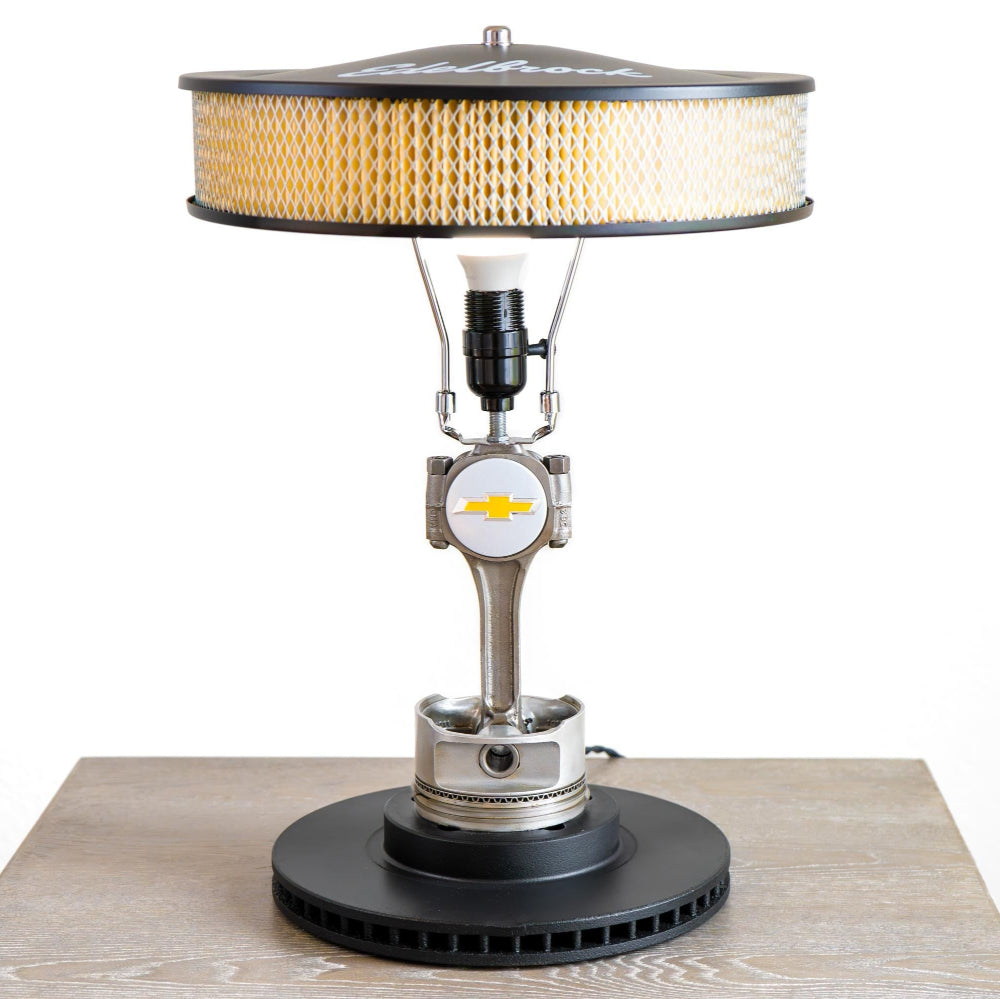 Vintage-style lamp with a unique design on a wooden surface