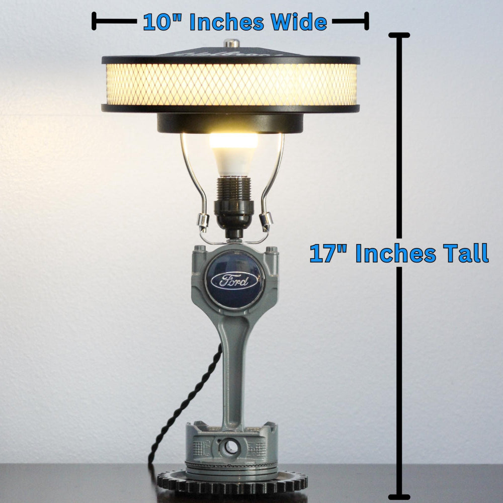 Table lamp with dimensions indicated on a gray background
