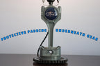 Ford engine block lamp with text 'Protective padding underneath gear' on a white background