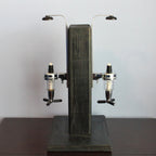 Vintage-style beer dispenser with wooden finish on a plain background