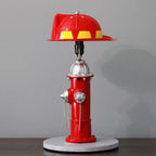 Red fire hydrant-shaped lamp on a gray background