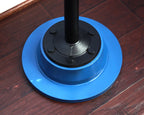 Blue and black circular object on a wooden surface