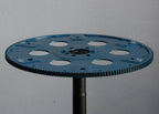 Blue gear wheel on a gray background
