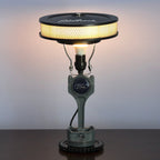 Ford branded lamp with vintage design on a dark surface against a light background