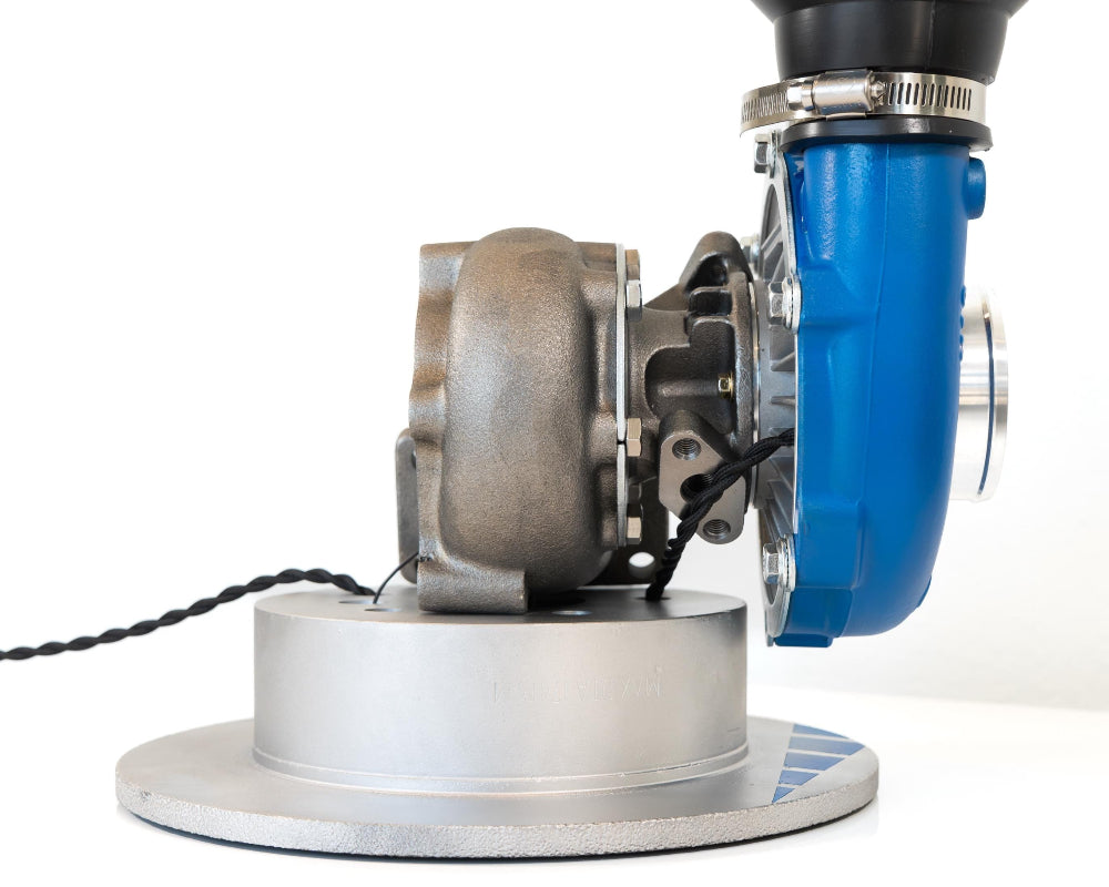 Close-up of a floor buffer with blue and silver design on a white background