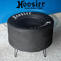 Fire pit table with Hoosier Racing Tire branding on a blue and gray background