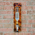 Decorative glass object with tortoiseshell pattern on a brick wall