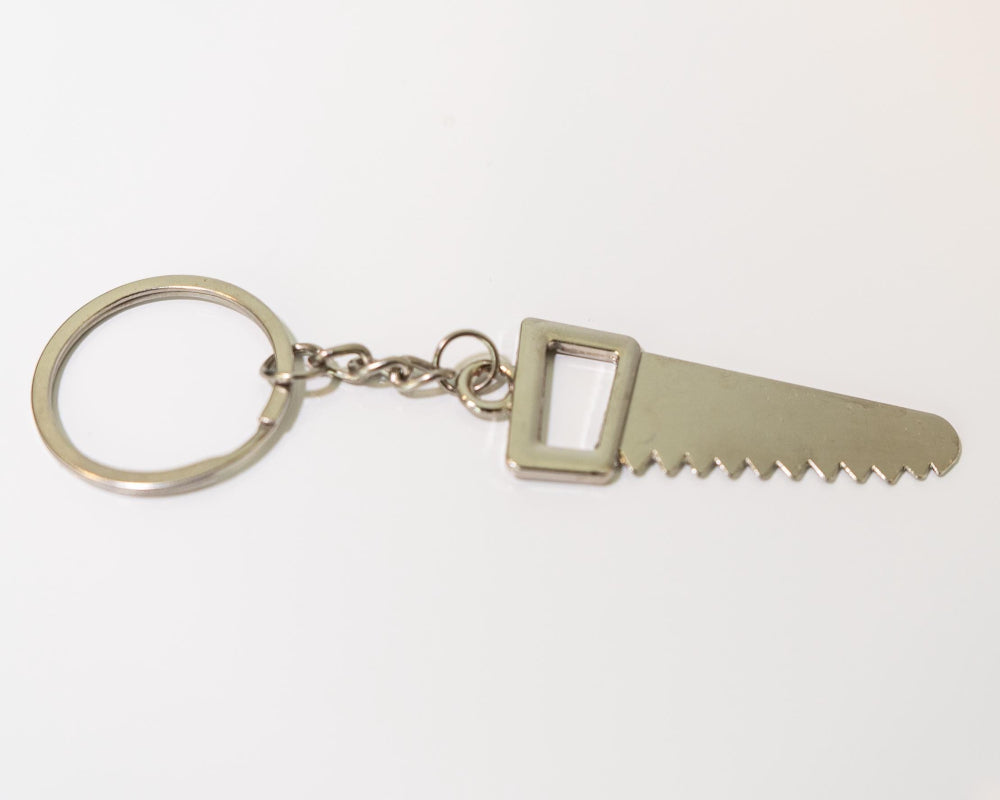 Metal keychain with saw blade design on a white background