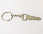 Metal keychain with saw blade design on a white background