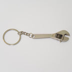 Metal wrench keychain on a white background