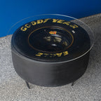 GoodYear Eagle tire on a gray surface with a blue background