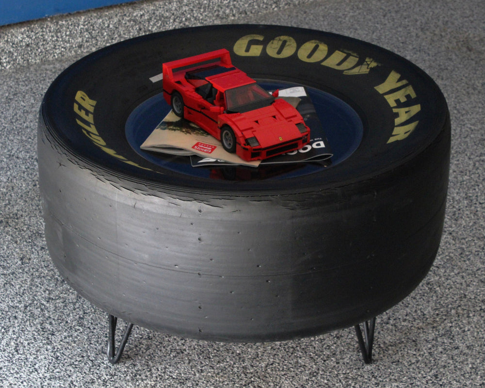 Automotive racing tire coffee table made from a real NASCAR tire, designed for garages, game rooms, and car themed spaces.