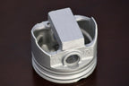 Metal piston on a dark background