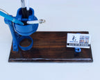 Blue valve on a wooden stand with a white background