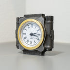 Decorative clock with a metallic casing on a light background
