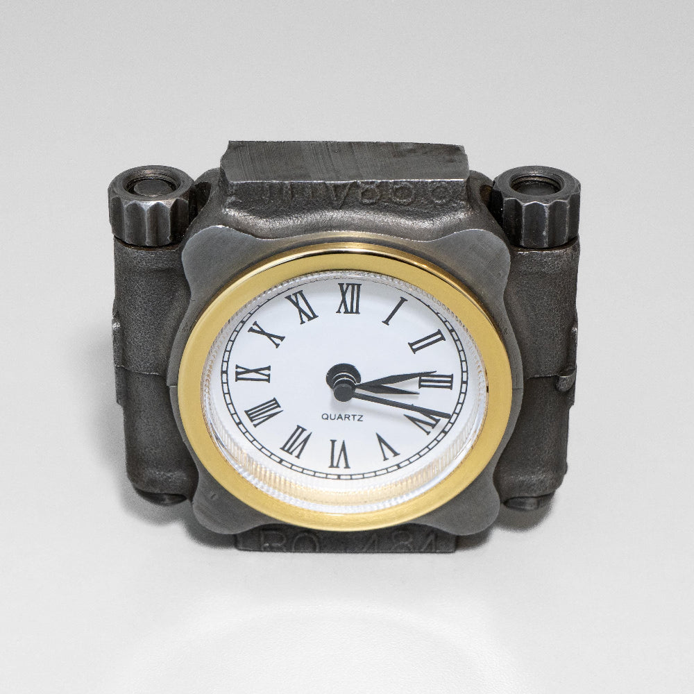 Mechanical-style clock with a gold rim and Roman numeral markers on a gray background